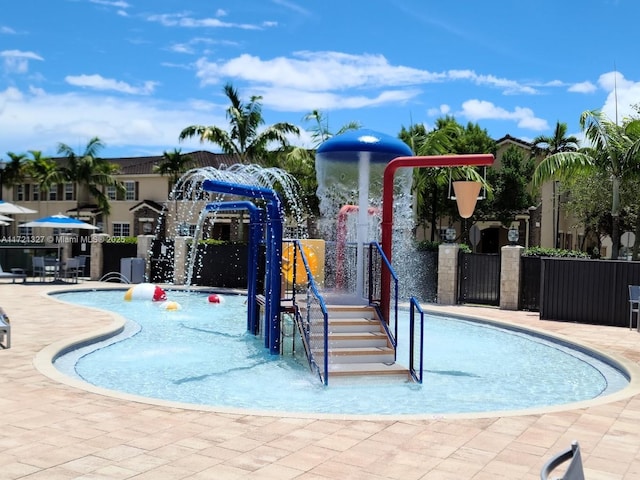 view of pool with pool water feature