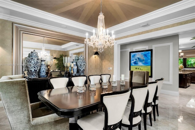 dining room featuring a chandelier and crown molding