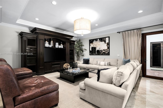 living room featuring a raised ceiling and crown molding