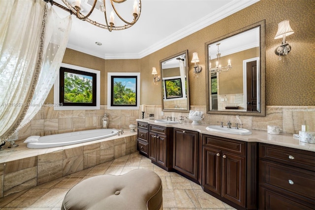 bathroom with tiled bath, a chandelier, tile patterned floors, ornamental molding, and vanity