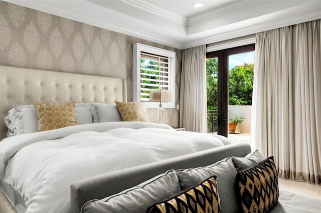 bedroom featuring access to exterior, ornamental molding, and a tray ceiling