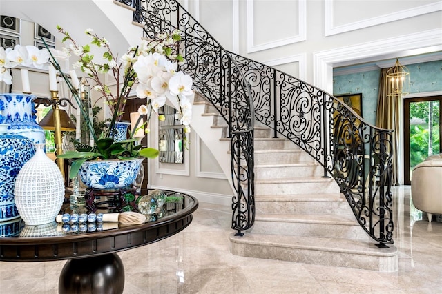 stairs featuring an inviting chandelier