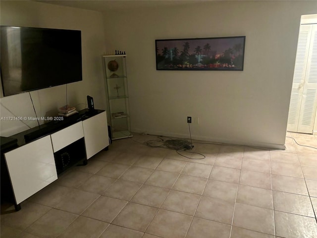 unfurnished living room with light tile patterned flooring