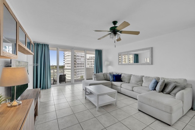 tiled living room featuring floor to ceiling windows and ceiling fan