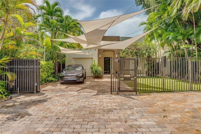 view of front of house featuring a front yard and a garage