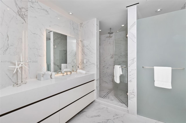 bathroom featuring a shower and vanity