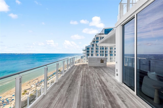 balcony with a view of the beach and a water view