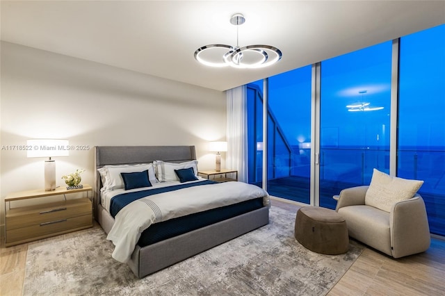 bedroom featuring floor to ceiling windows