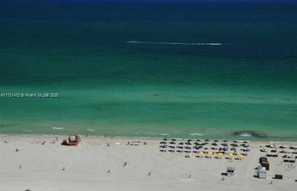 property view of water with a beach view