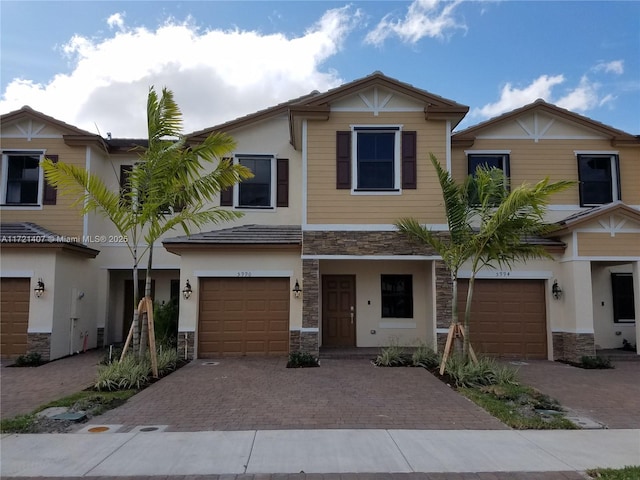 multi unit property featuring a garage