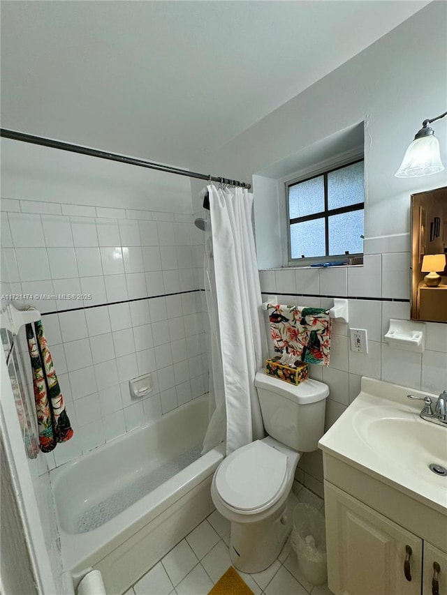 full bathroom with shower / bath combo, tile patterned floors, vanity, tile walls, and toilet