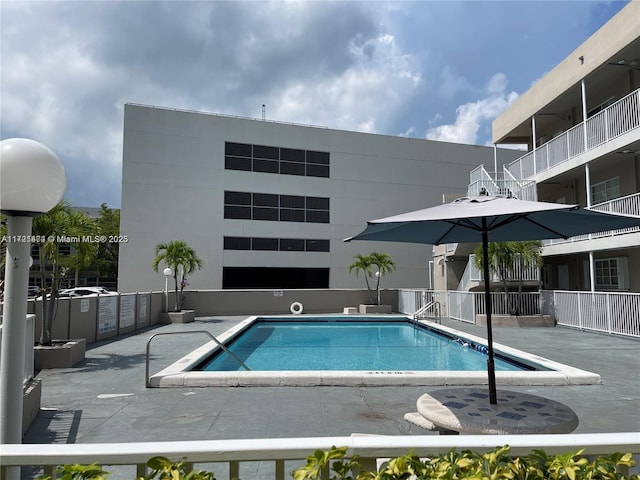 view of swimming pool featuring a patio