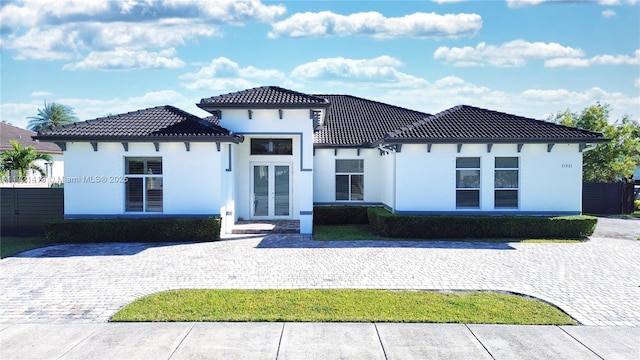 back of house featuring french doors