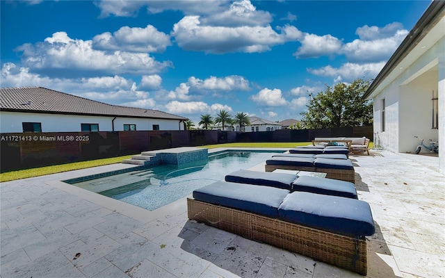 view of swimming pool featuring a patio area