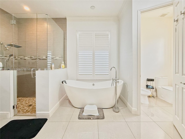 bathroom with tile patterned flooring, separate shower and tub, toilet, and a bidet