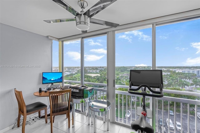 sunroom featuring a wealth of natural light and ceiling fan