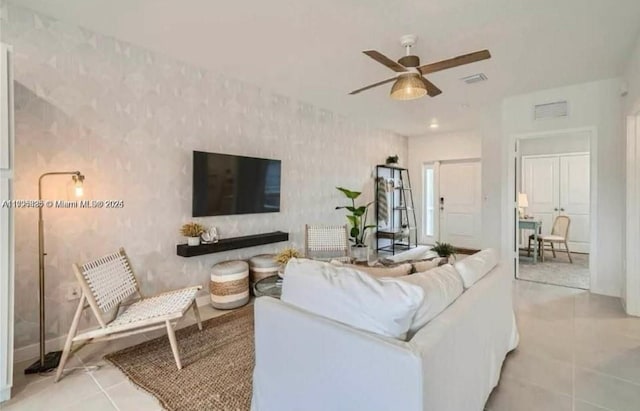 tiled living room featuring ceiling fan