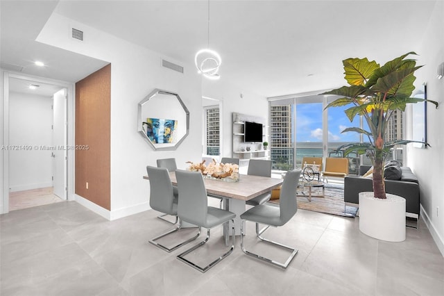 dining room featuring a wall of windows