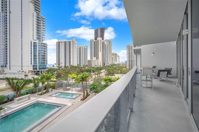 balcony featuring a hot tub