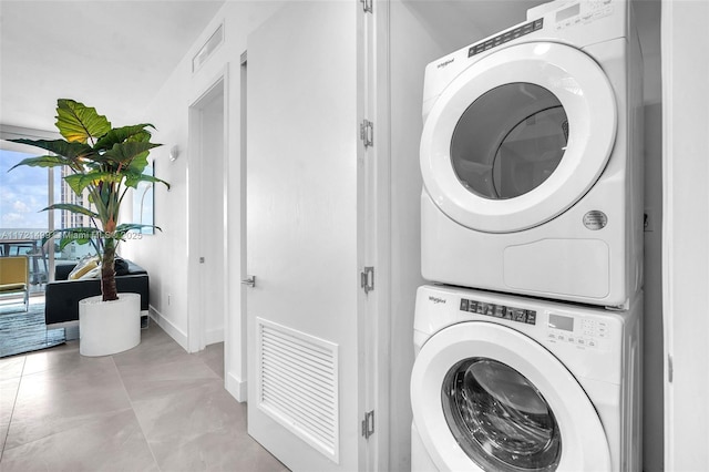 laundry room featuring stacked washer and dryer