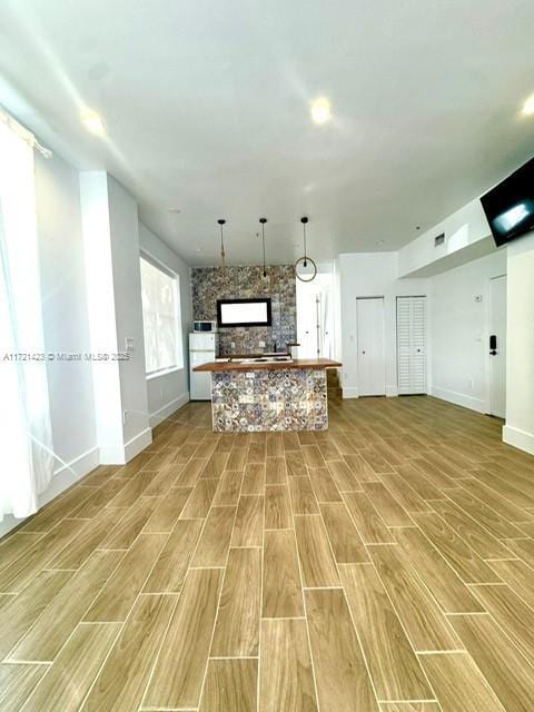 kitchen with hardwood / wood-style flooring