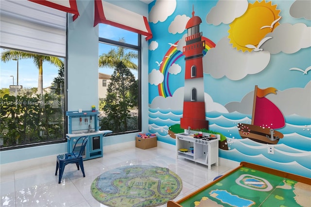 recreation room with tile patterned floors