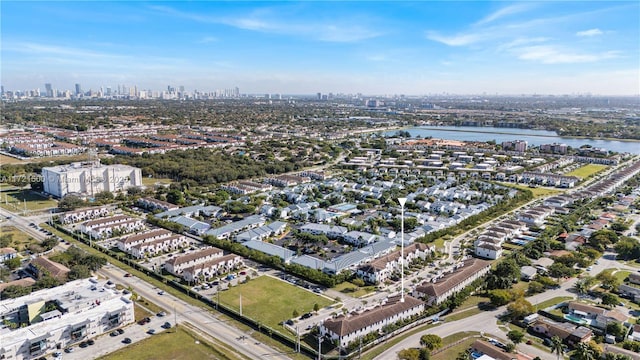 drone / aerial view with a water view and a city view