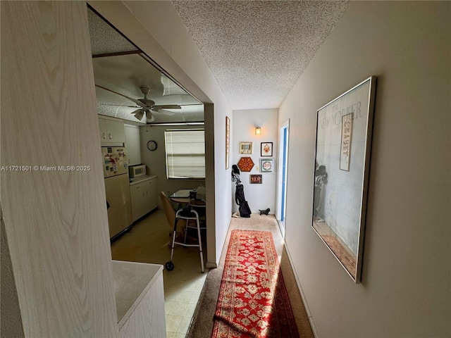 3019 Exeter B 3019, Boca Raton, FL 33434 - hallway with a textured ceiling and light colored carpet
