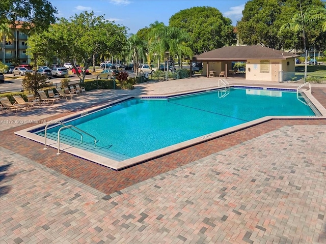 view of swimming pool featuring a patio area