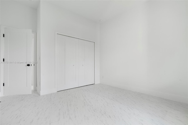 unfurnished bedroom featuring a closet