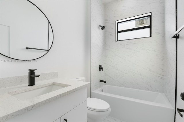 full bathroom featuring toilet, vanity, and tiled shower / bath combo