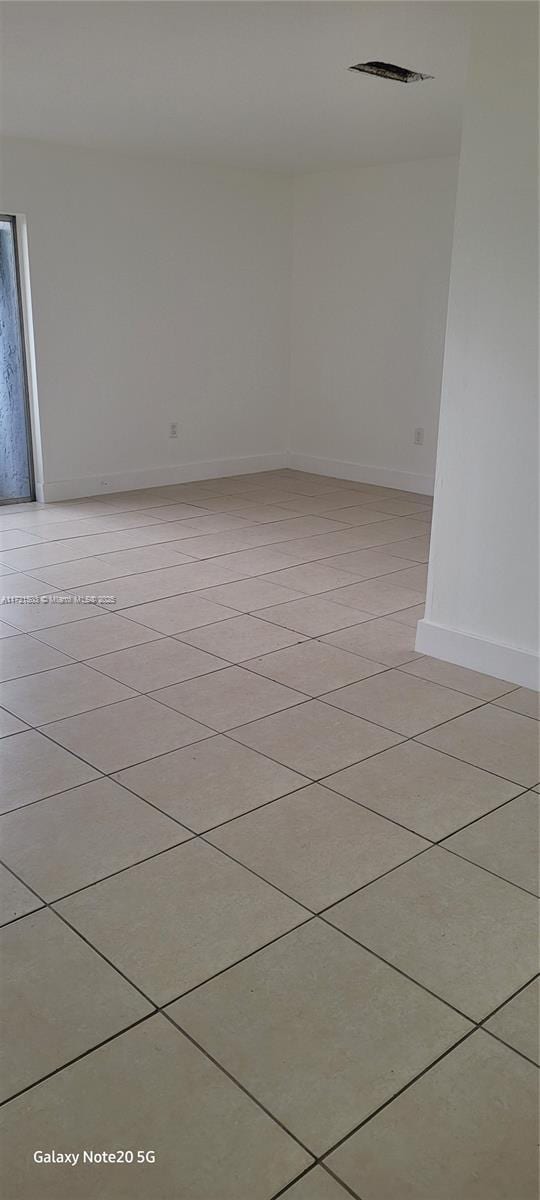 view of tiled spare room