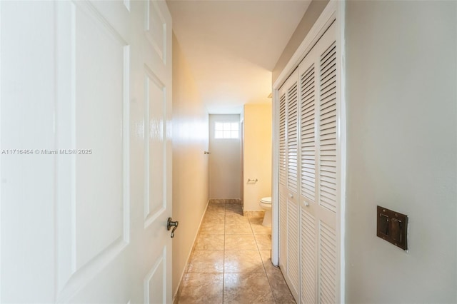 corridor featuring light tile patterned flooring