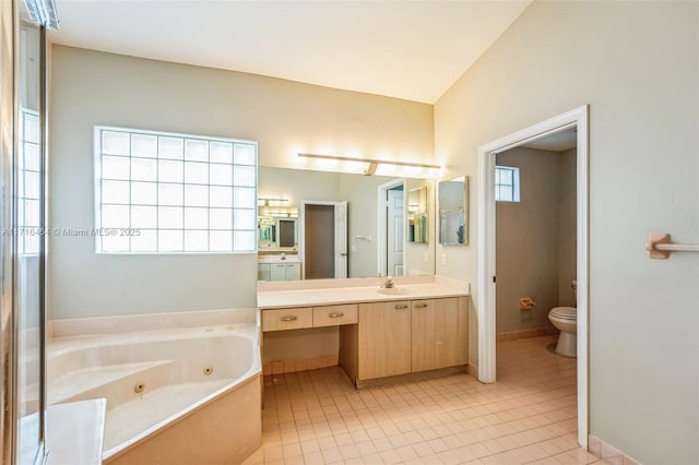 bathroom with toilet, a bathing tub, tile patterned floors, and vanity