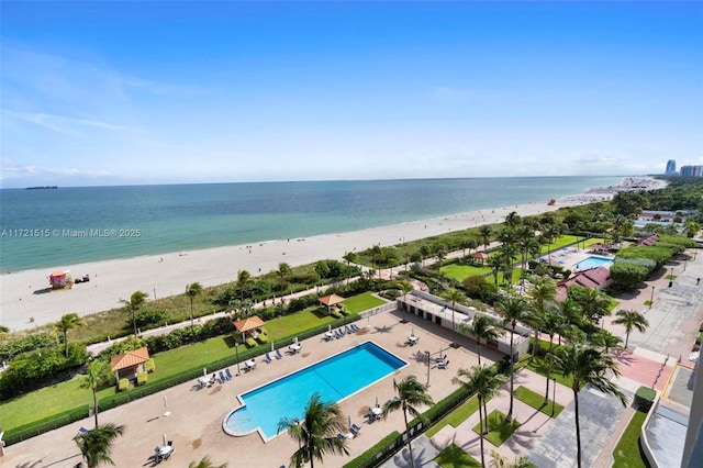 drone / aerial view featuring a view of the beach and a water view