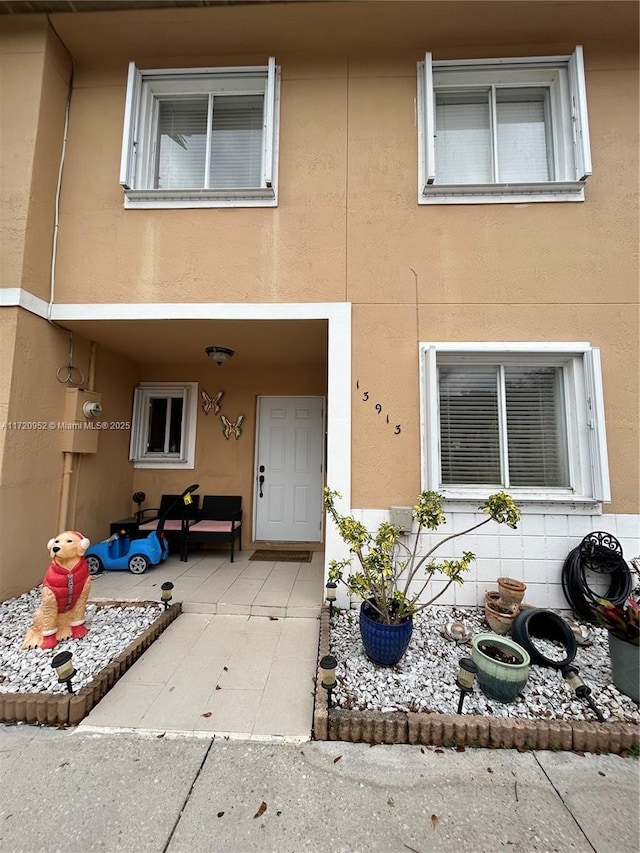 doorway to property featuring a patio