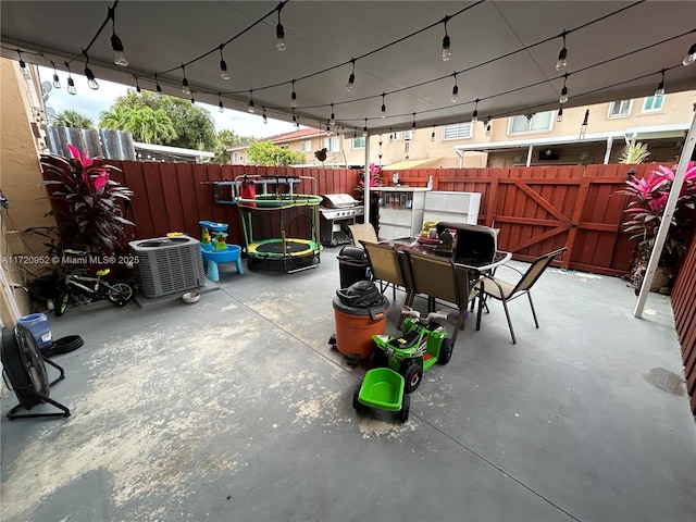 view of patio / terrace featuring a grill and cooling unit