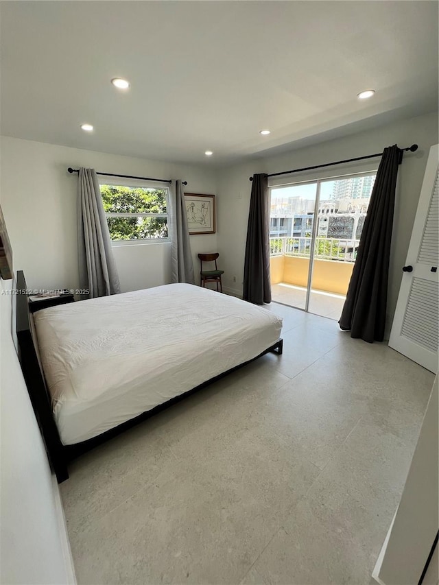 bedroom featuring access to outside and multiple windows