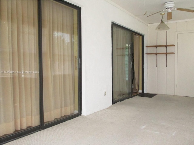 exterior space featuring ceiling fan and a patio area