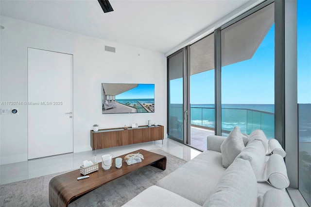 living room featuring floor to ceiling windows