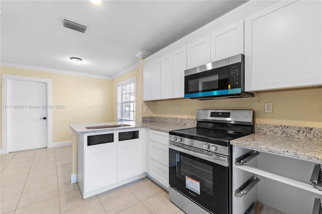 kitchen with white cabinets, stainless steel appliances, kitchen peninsula, and crown molding