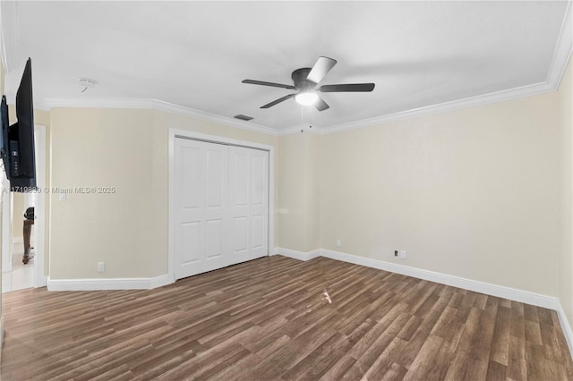 unfurnished bedroom featuring a closet, ceiling fan, and crown molding