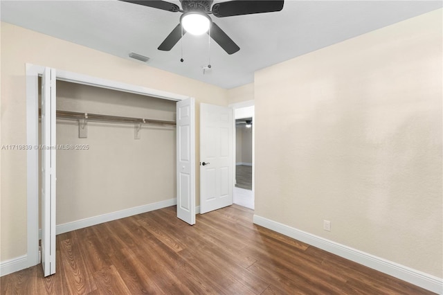 1574 NW 7th Ln, Pompano Beach, FL 33060 - unfurnished bedroom featuring wood finished floors, a closet, and a ceiling fan