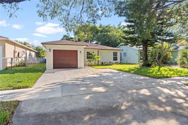 ranch-style house featuring a garage and a front lawn