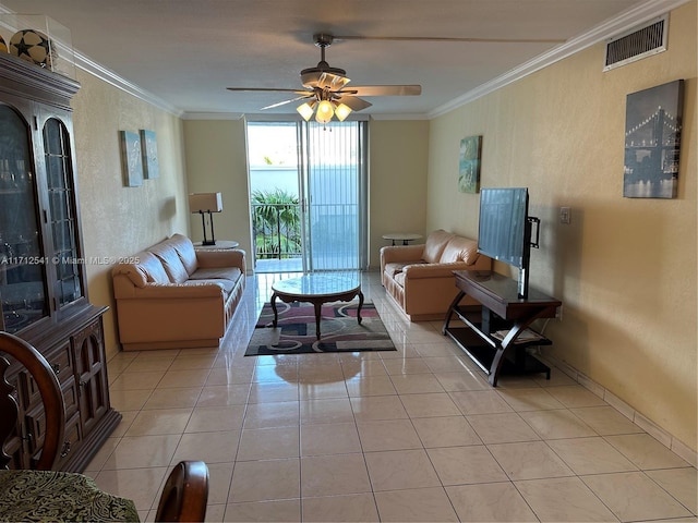 tiled living room with ceiling fan and crown molding