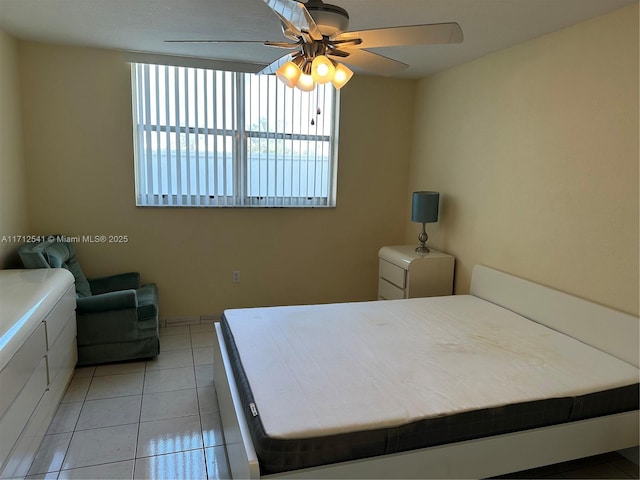 unfurnished bedroom with ceiling fan and light tile patterned flooring