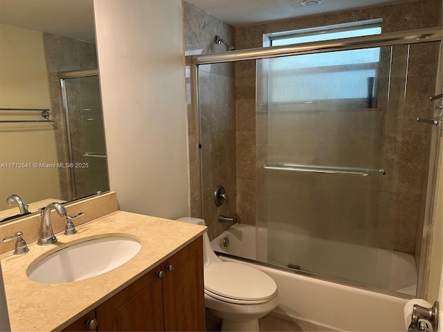 full bathroom with vanity, toilet, and enclosed tub / shower combo