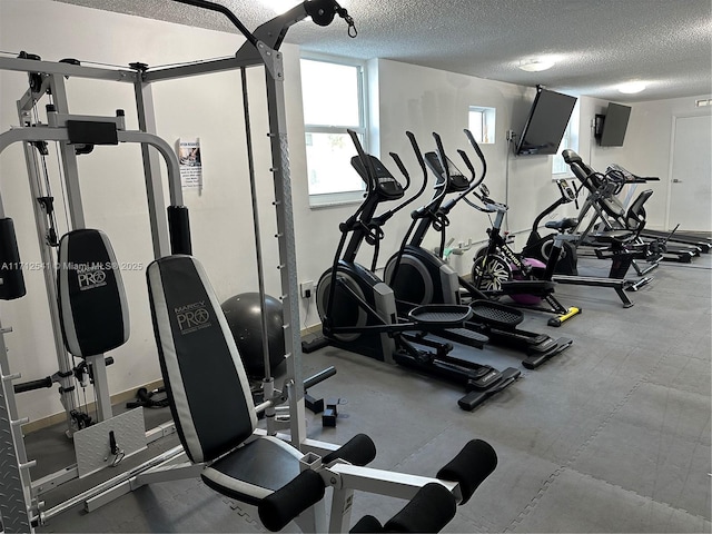 gym with a textured ceiling