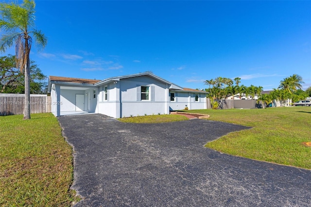 ranch-style home with a front lawn