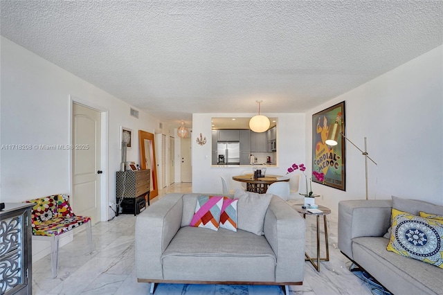 living room with a textured ceiling